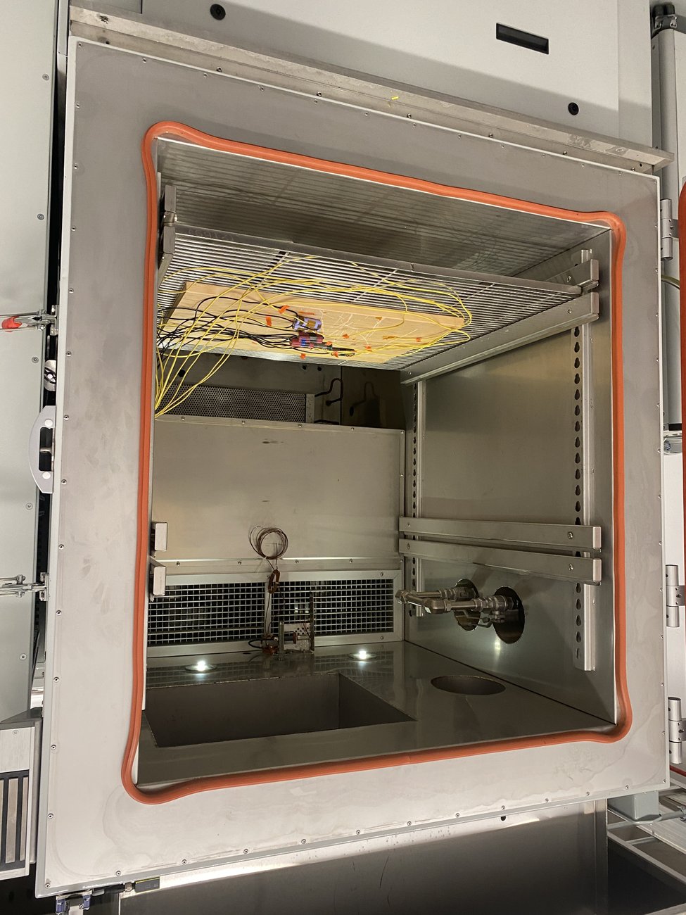 Instrumented and run inside a real environmental test chamber, not just on a bench.
